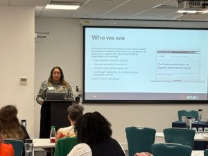 Dionne speaking at a conference